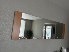 Wooden surround either mirror