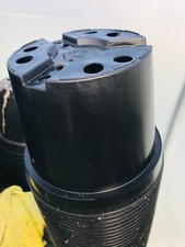 NEW UNUSED BLACK PLASTIC PLANT