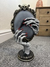 Skeleton Holding A Mirror