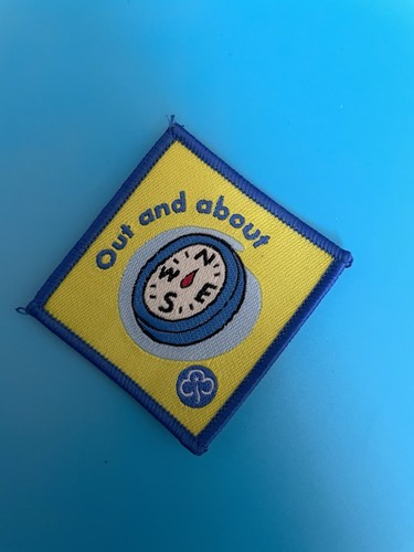 Girlguiding old out - and, about