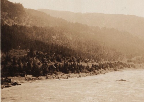 Small boat river canyon scene - small,