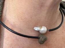 Cultured Natural Pearl And Iron Pyrites On A Black Round Rubber Coated Thong.