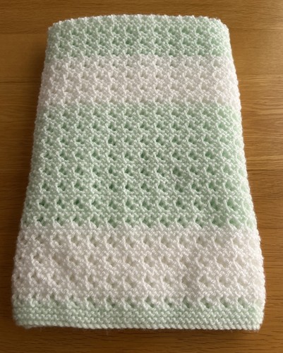 Hand knitted white - hand, green