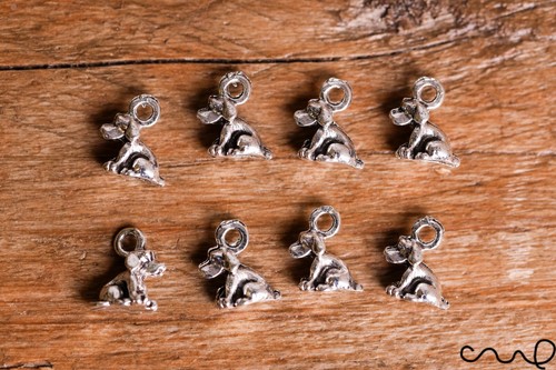 Tiny silver sitting dog - 3d,
