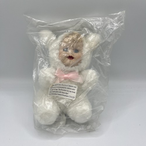 Porcelain doll baby - doll,
