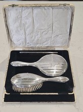 ANTIQUE SILVER VANITY SET. HAND MIRROR, BRUSH  & COMB IN A FAUX SNAKE SKIN CASE.