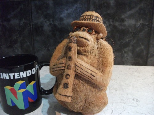 Carved coconut monkey with - coconut,
