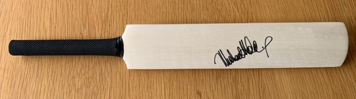 Michael holding signed mini - holding,
