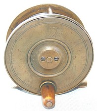 AN ALEX MARTIN 'THISTLE' 2 3/4 INCH BRASS TROUT FISHING REEL.      (1308)