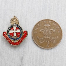 A vintage The Girls Brigade 'Auxiliary' award enamel pin back brooch badge