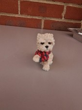 West Highland White Terrier also known as a Westie. Its possibly made of resin