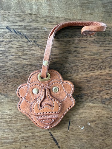 Kipling monkey face brass - face, tan