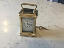 A BEAUTIFUL ANTIQUE MINIATURE BRASS CARRIAGE CLOCK WITH KEY, G.W.O.