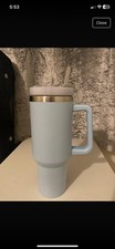 Blue metal tumbler with handle and plastic straw 