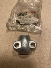 Genuine Yamaha TY YZ DT MX CT AT Fromt Axle Holder. 315-23167-51 NOS.