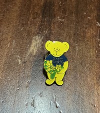 MARIE CURIE PIN BADGE COLLECTABLE BEAR BADGE WITH YELLOW FLOWERS