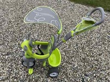 SMOBY GREEN CHILD TRICYCLE WITH SUNSHADE + STEERING WHEEL. USED. GOOD CONDITION