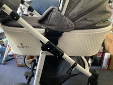 Grey And White Leatherette Pram