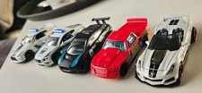 Hot Wheels Jaguar, Truck, Corvette and two Dubai police cars