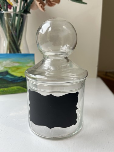 Glass jar with - with, label