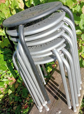 Nest of 7 tubular light metal stacking any environment stools never used
