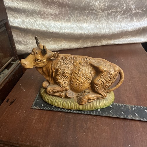 Resting bull nativity figure - bull,