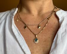 Diamond pendant: blue tourmaline surrounded by 5 diamonds in 14ct gold setting