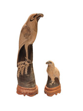 2 carved buffalo horn bird