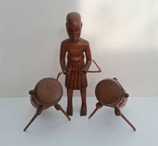 Vintage 1950's West African wooden carving of man playing Talking Drums