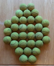 32 used tennis balls for
