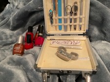 Manicure kit in metal carry case plus nail varnishes..