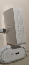 Apple Cinema HD Display 90W Power Adapter model A1097 and an Apple desktop mouse