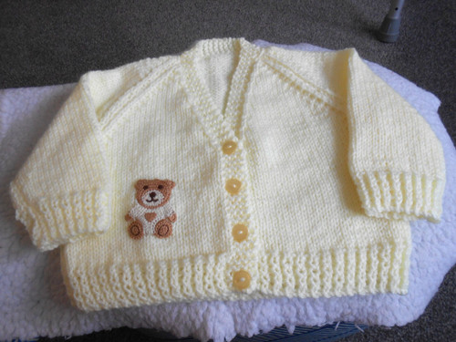 Hand knitted lemon teddy - hand,