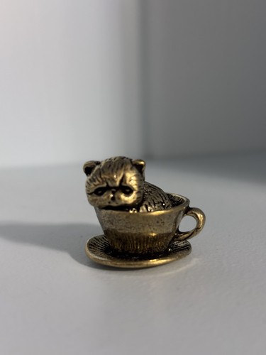 Small brass cat - in, teacup