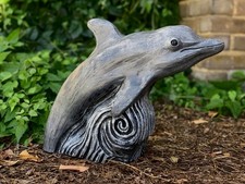 Stone dolphin statue Ocean
