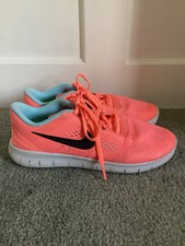NIKE Free RN Coral Trainers