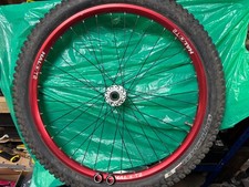 Red 26 inch Halo T2 MTB wheel with Specialised Butcher tyre. 20mm thru axle