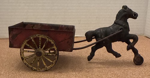 Antique horse drawn tin - horse,