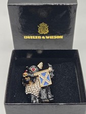 Vintage BUTLER & WILSON SCOTTIE DOG brooch holding a sparkly Scottish flag