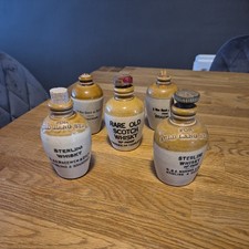 SET OF FIVE VINTAGE MINATURE SCOTISH STONEWARE WHISKY FLAGONS.