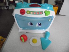 Leap Frog kid's oven with lights & sounds + spatula strawberry & wooden egg