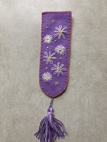 Hand embroidered tasseled book - hand,