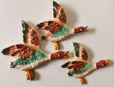 Flying ducks plaster wall