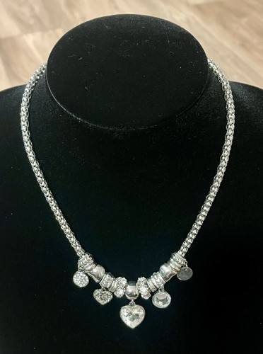 Next silver tone charm - next,