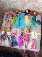 Girls/boys barbie & other dolls x 9 & a couple of outfits