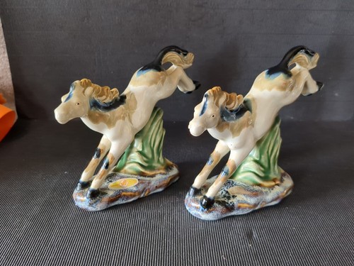 Pair vintage bucking horses - of,