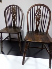 2 vintage wheelback chairs