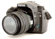 Pentax k20D w/ 18-55 Pentax lens.  14.6 MP. Mint condition shutter count 2836.