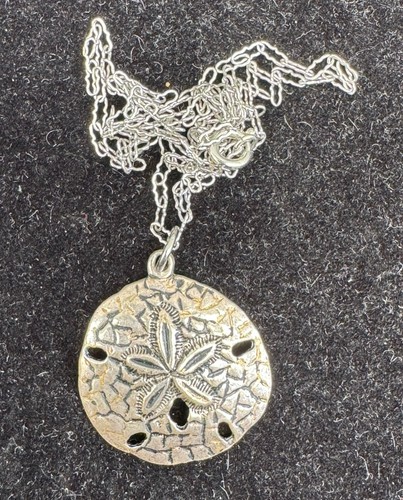 Designer sand dollar shell - dollar,