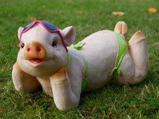 Sunbathing pig garden ornament - sunbathing,